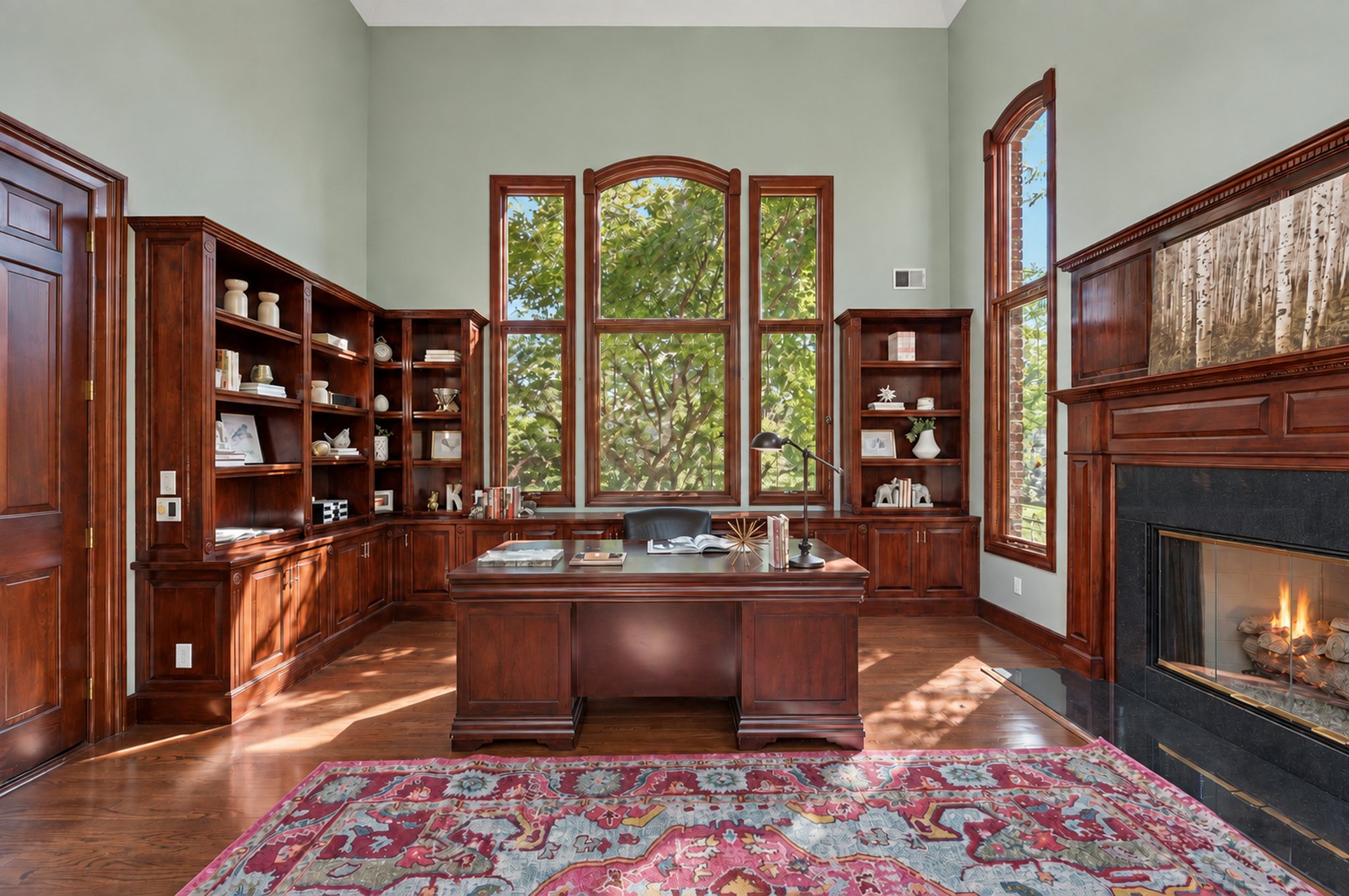 Private office with wood built ins, arched windows and fireplace at 54 Burnet Hill Road, Livingston